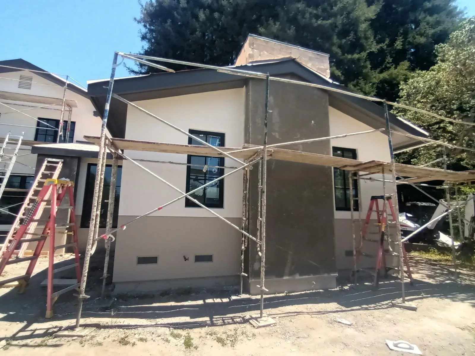 Exterior house painting in San Jose, CA with scaffolding set up