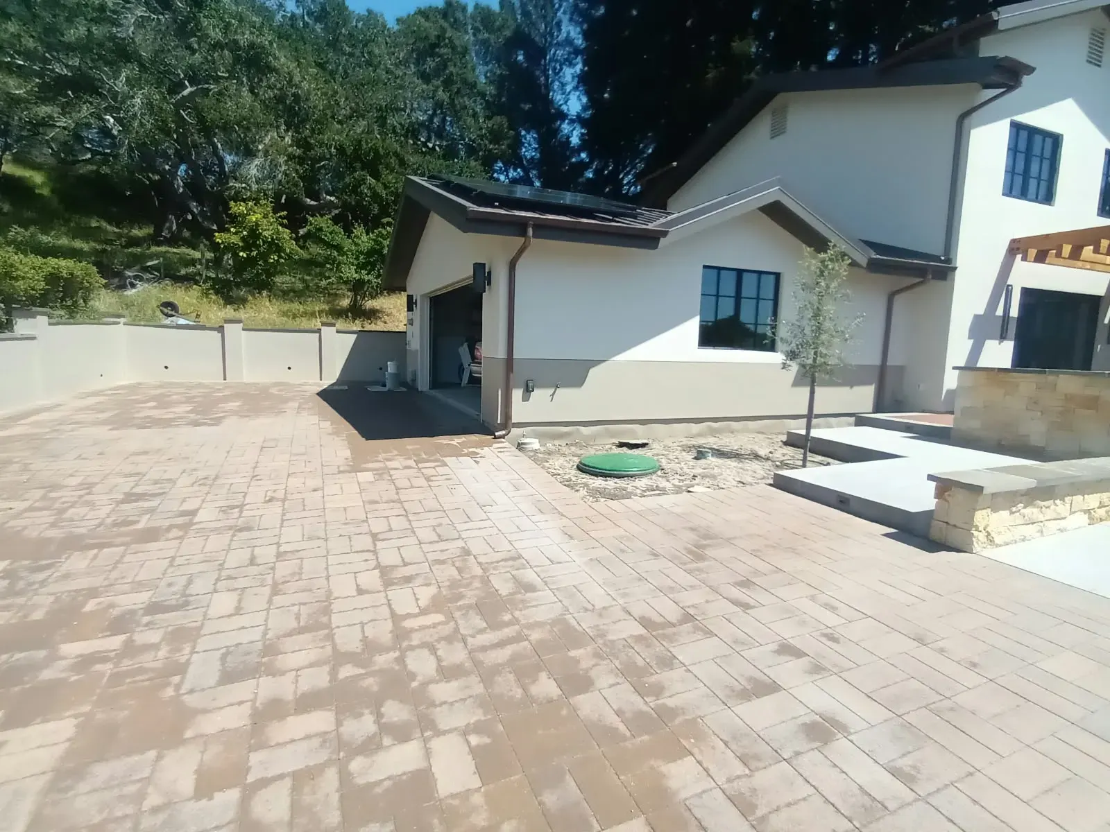 Exterior painting in Los Gatos, CA: painted home with stone and wood details