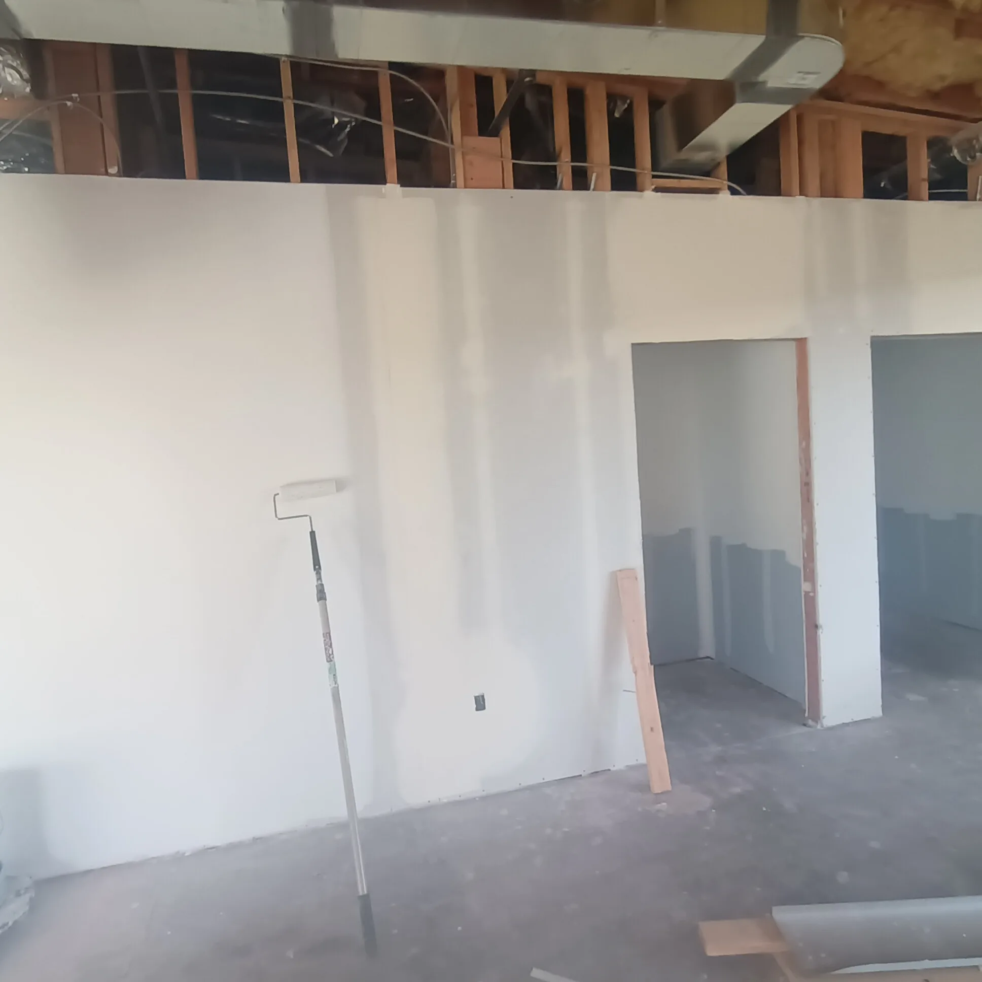 Drywall repair in San Jose, CA: patched and primed drywall with paint roller