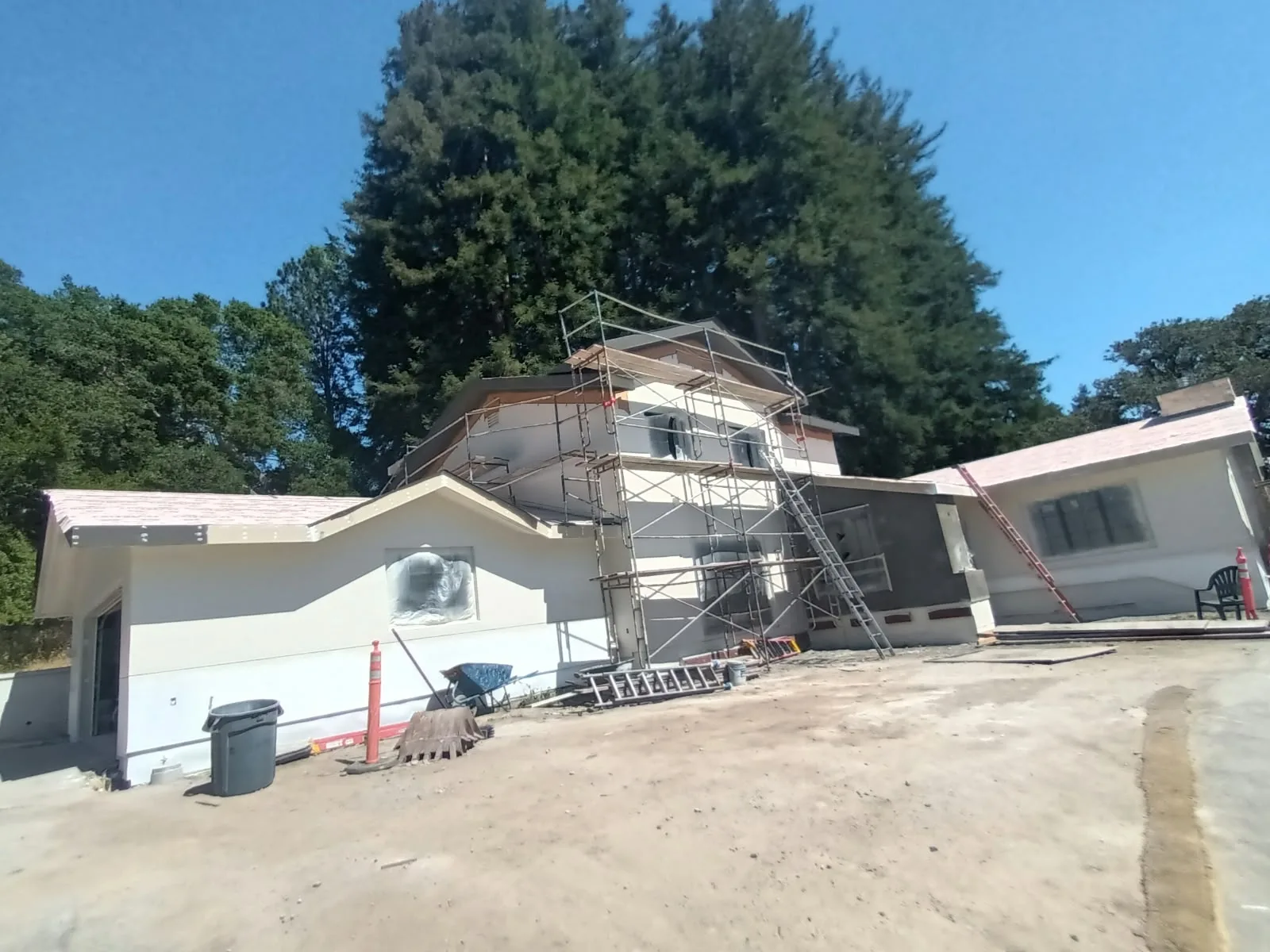 Exterior painting in San Jose, CA: home exterior repaint in progress with scaffold