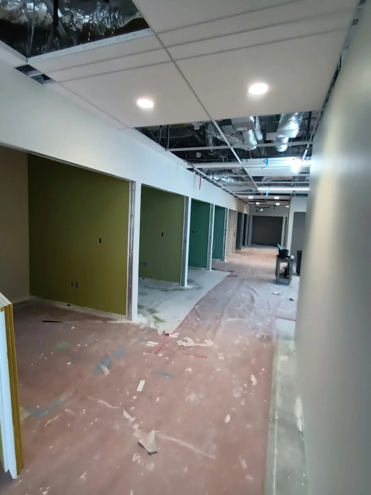 Drywall finishing in San Jose, CA: corridor with finished drywall and painted accent walls