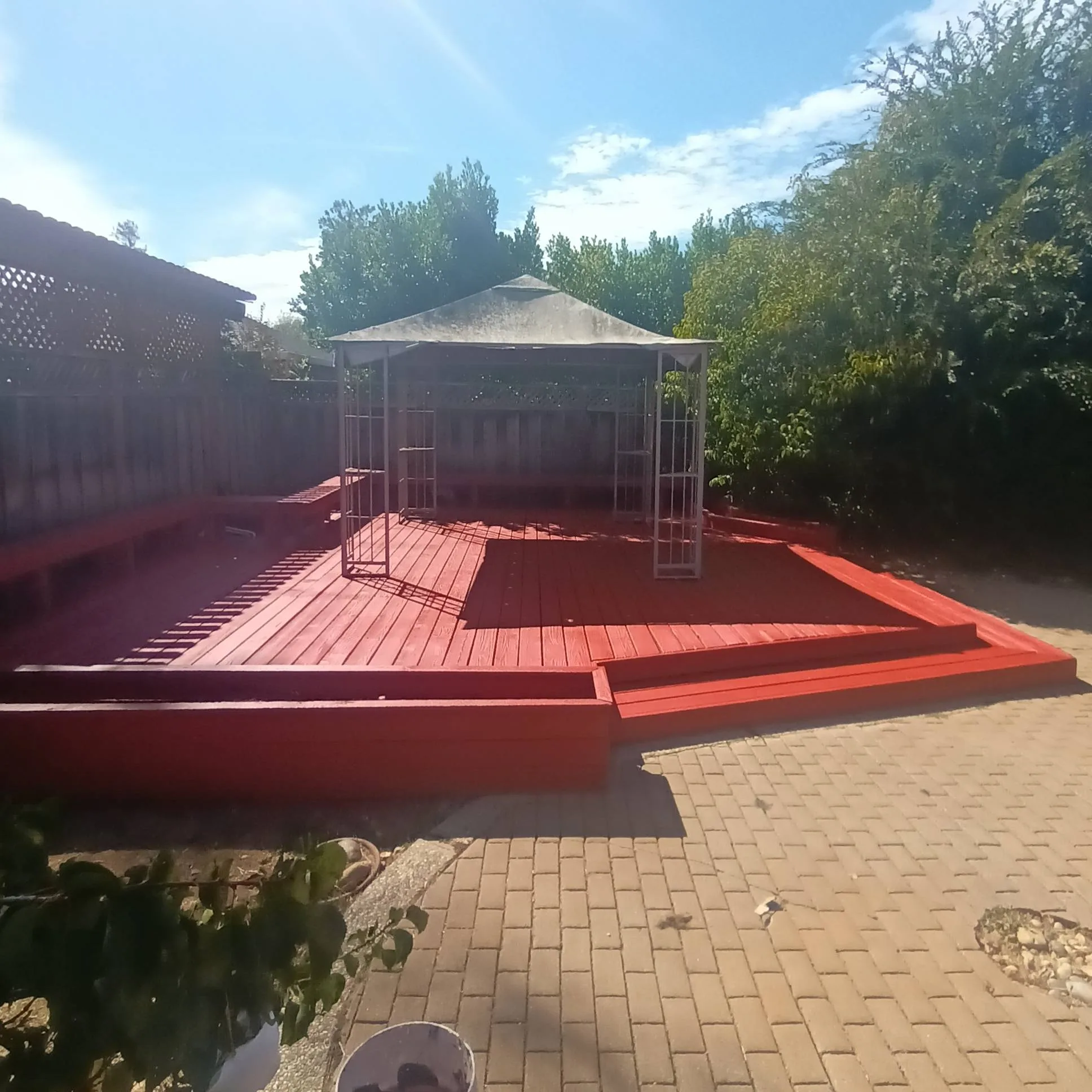 Deck painting in San Jose, CA: freshly painted red wood deck and gazebo