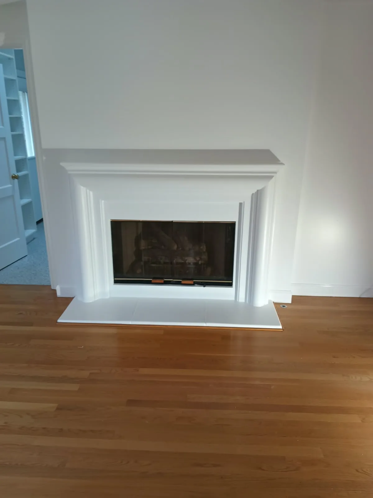 Interior painting in San Jose, CA: freshly painted white fireplace mantel